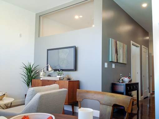 Living and dining area with mid century modern furnishings at 68 Beale Apartments, Massachusetts, 02169